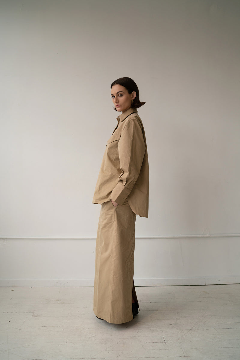 HCTR Long Poplin Boxer Skirt in Fawn side profile view styled with matching oversized poplin button-down