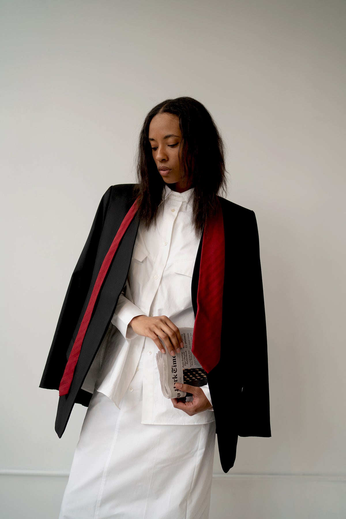 HCTR Oversized Cotton Poplin Button Down in White layered under black blazer with red scarf — editorial styling