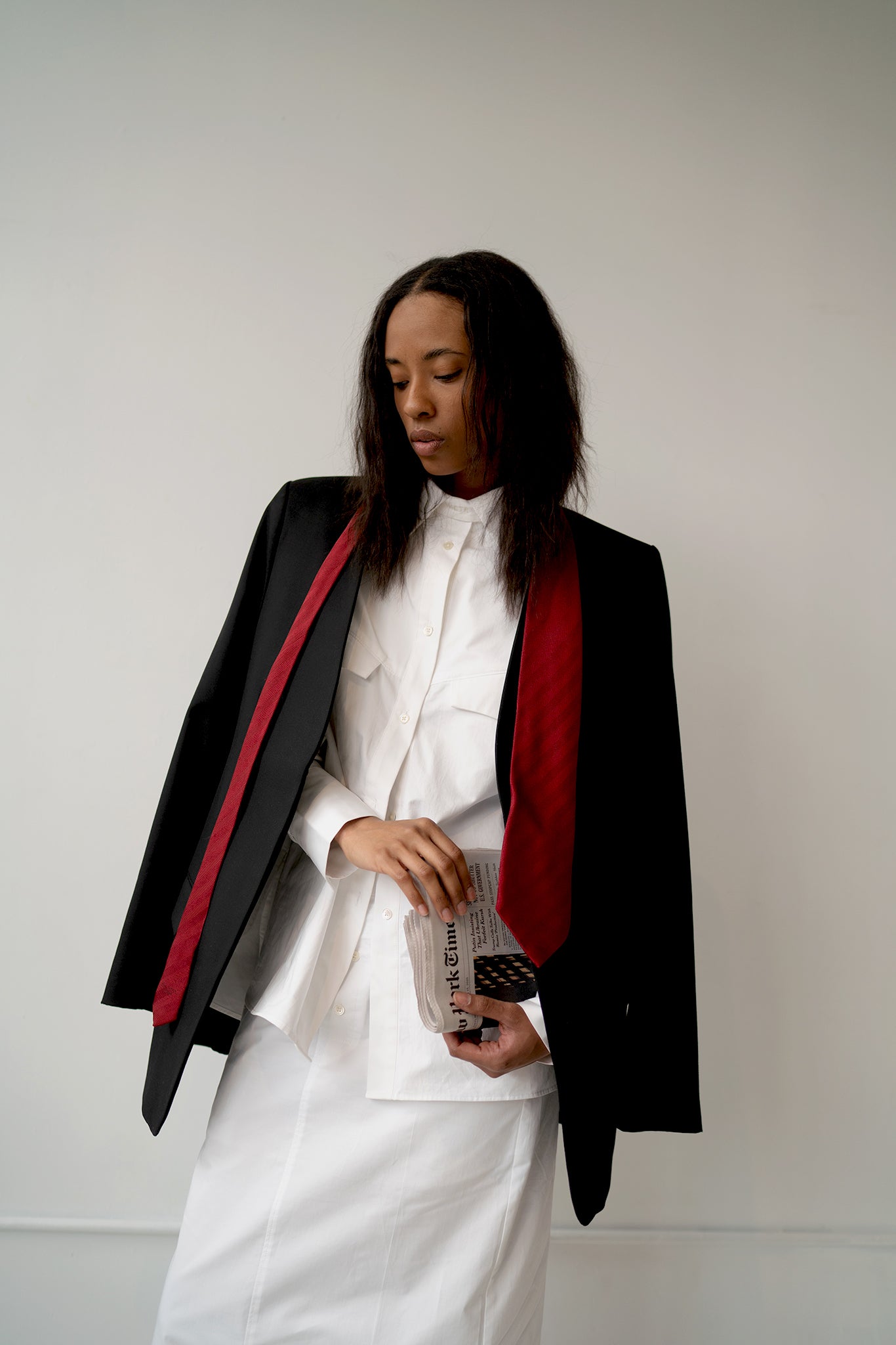 HCTR Oversized Cotton Poplin Button Down in White layered under black blazer with red scarf — editorial styling